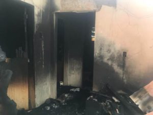 Familiares de pai e filho mortos em incêndio em santiago